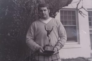 Larry Perry Holding his award.