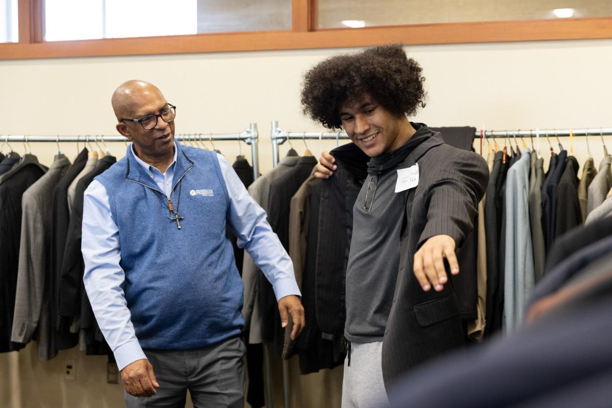 Students who attend Dress to Impress try on professional clothing