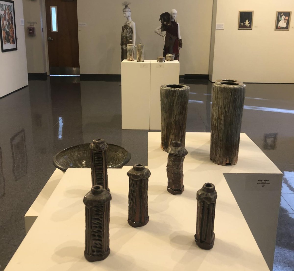 The Cragin Art Gallery exhibit showcases some pottery pieces on display